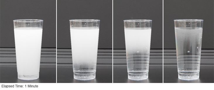 Four glasses showing the clearing of air bubbles in water
